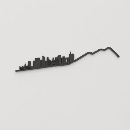 Decoración de pared con la silueta del skyline de Caracas color negro.