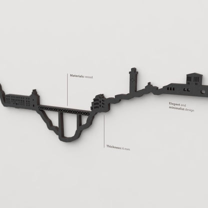 Decoración de pared negra con la silueta del skyline de Cuenca.