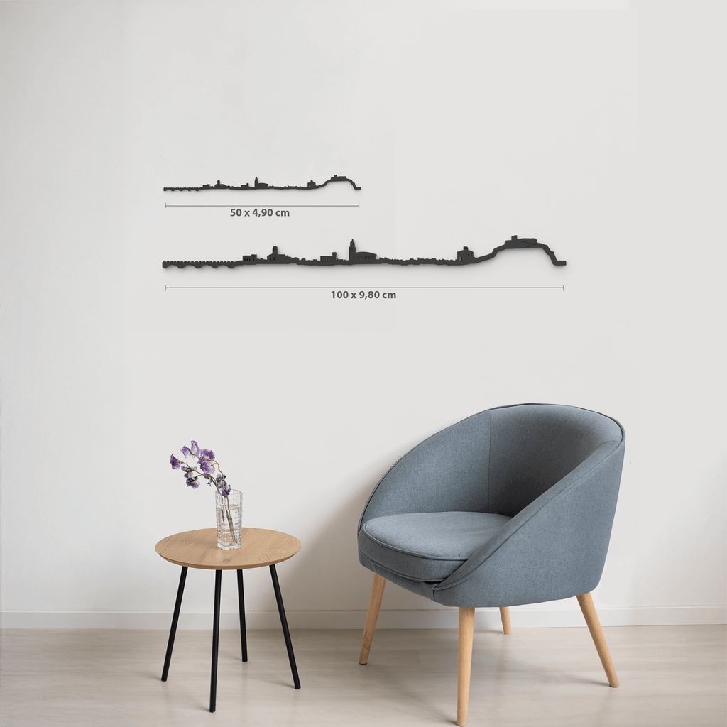 Comparativa de tamaños 50 cm y 100 cm de la silueta de Arnedo en una pared de salón.