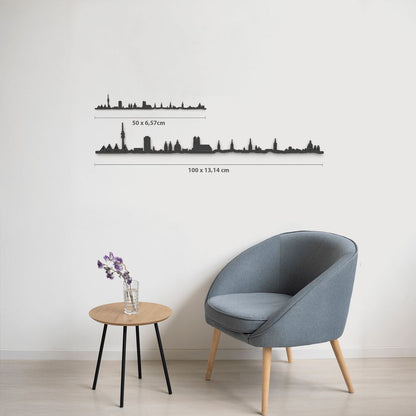 Comparativa de tamaños 50 cm y 100 cm de la silueta de München en una pared de salón.