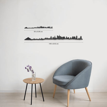 Comparativa de tamaños 50 cm y 100 cm de la silueta de Warszawa en una pared de salón.