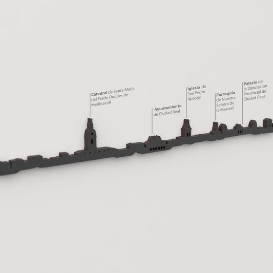 Detalle de la Catedral de Santa María del Prado en la silueta de Ciudad Real en madera negra.