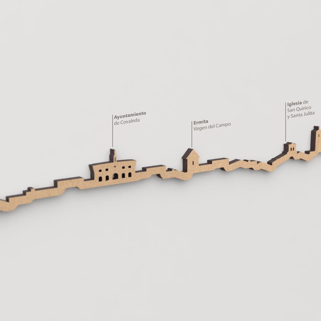 Detalle de la Iglesia de San Quirico y Santa Julita en el skyline marrón de Covaleda.