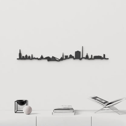 Silueta skyline de Dublín en madera negra, con The Spire como elemento central.