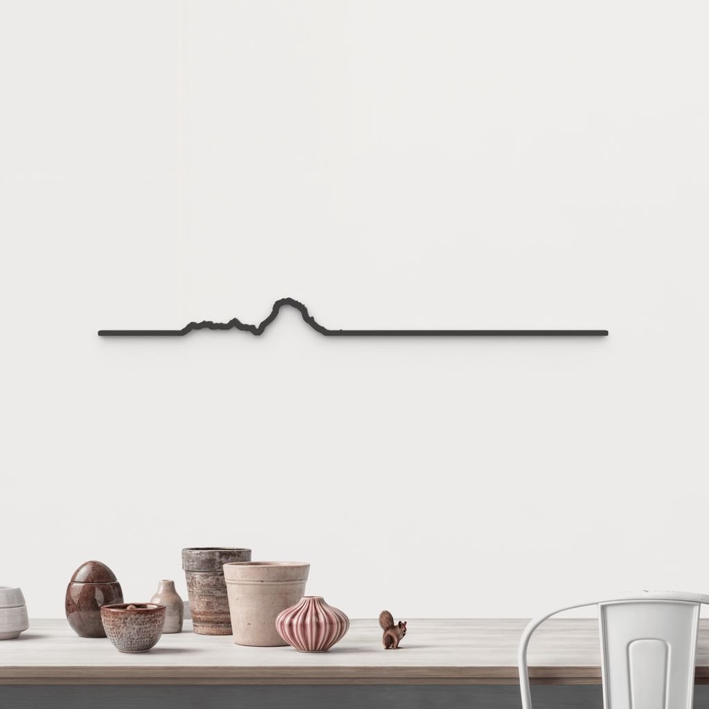 Silueta de Es Vedrà y Es Vedranell en madera negra, una vista mágica del horizonte ibicenco.