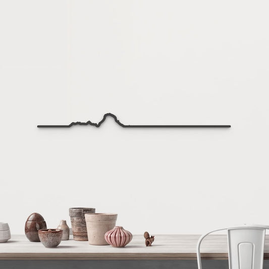 Silueta de Es Vedrà y Es Vedranell en madera negra, una vista mágica del horizonte ibicenco.