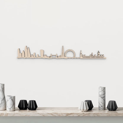 Silueta skyline de Londres en madera natural para decoración mural.