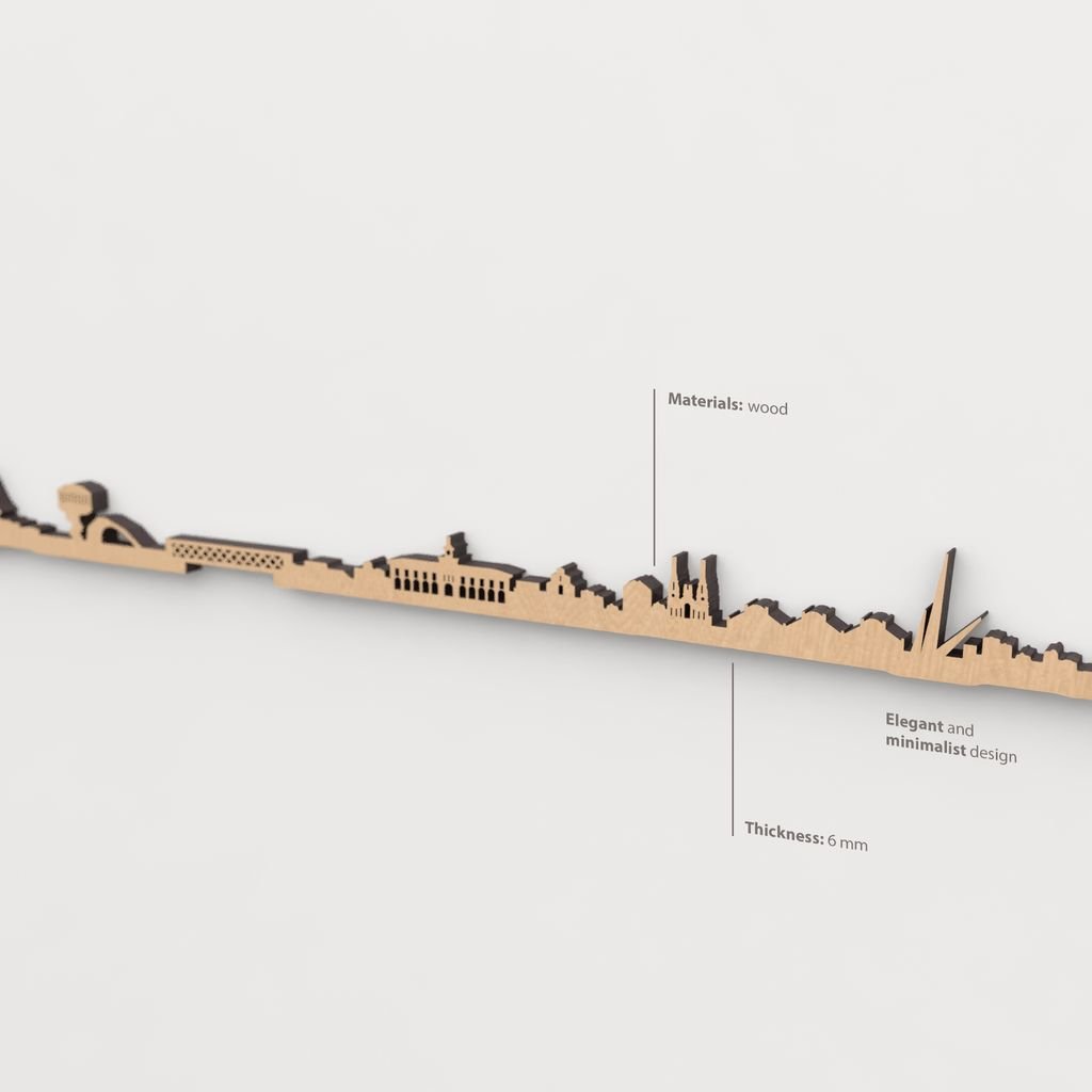 Vista en perspectiva de la silueta del skyline de Avilés en madera marrón.