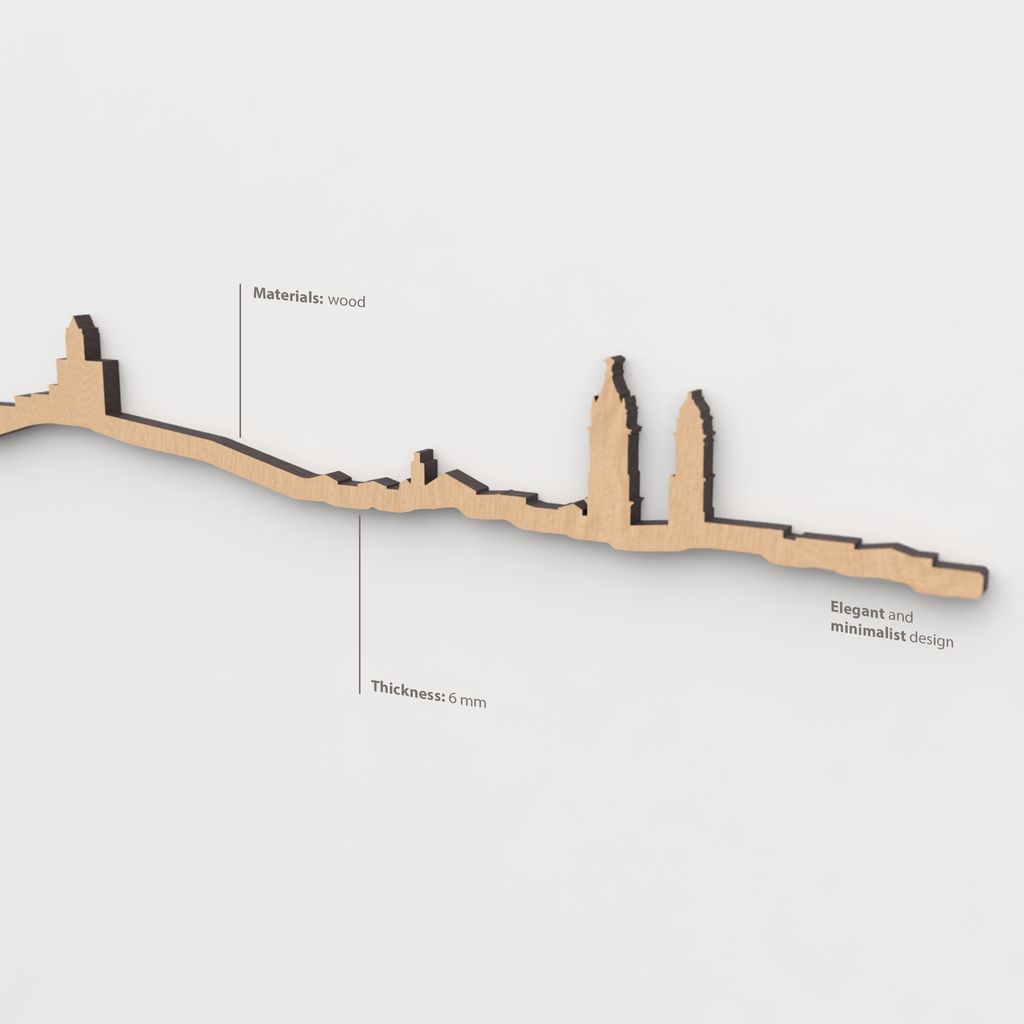 Vista en perspectiva de la silueta del skyline de Antequera en madera marrón.