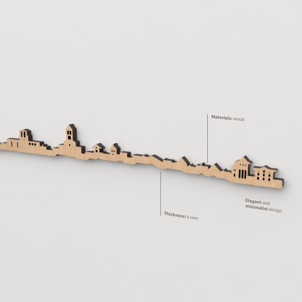 Vista en perspectiva de la silueta del skyline de Camprodon en madera marrón.
