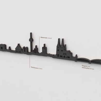 Vista en perspectiva de la silueta del skyline de Köln en madera negra.