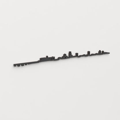 Perspectiva lateral del skyline Sahagún en madera negra.